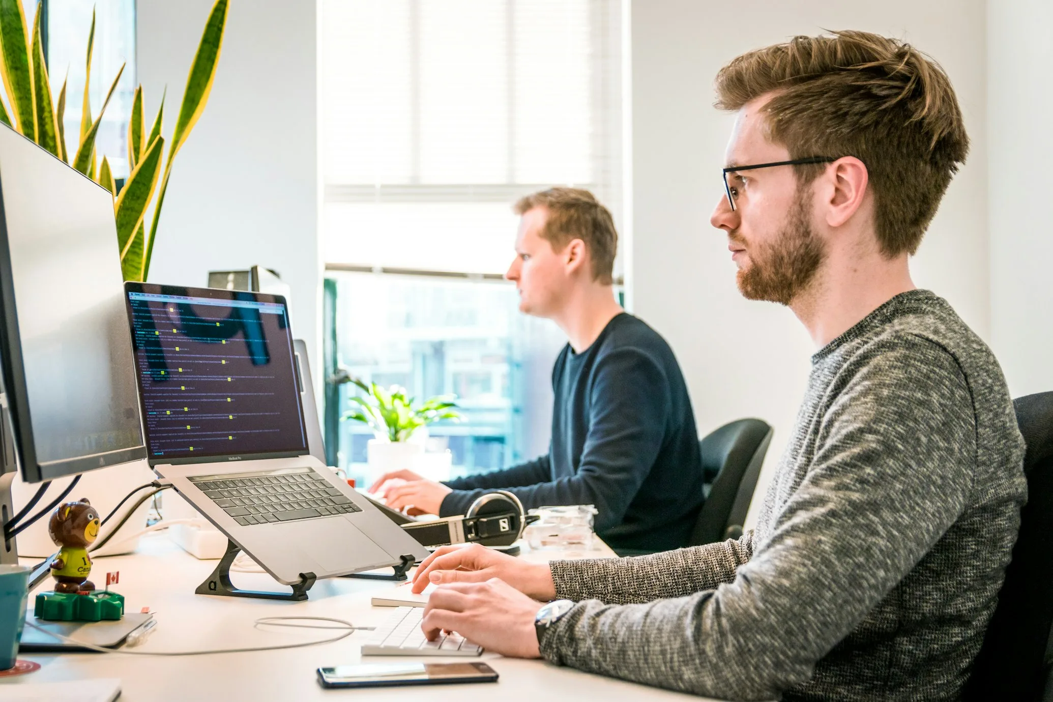 FactualMinds architects reviewing agent evaluation results and AWS cost dashboards